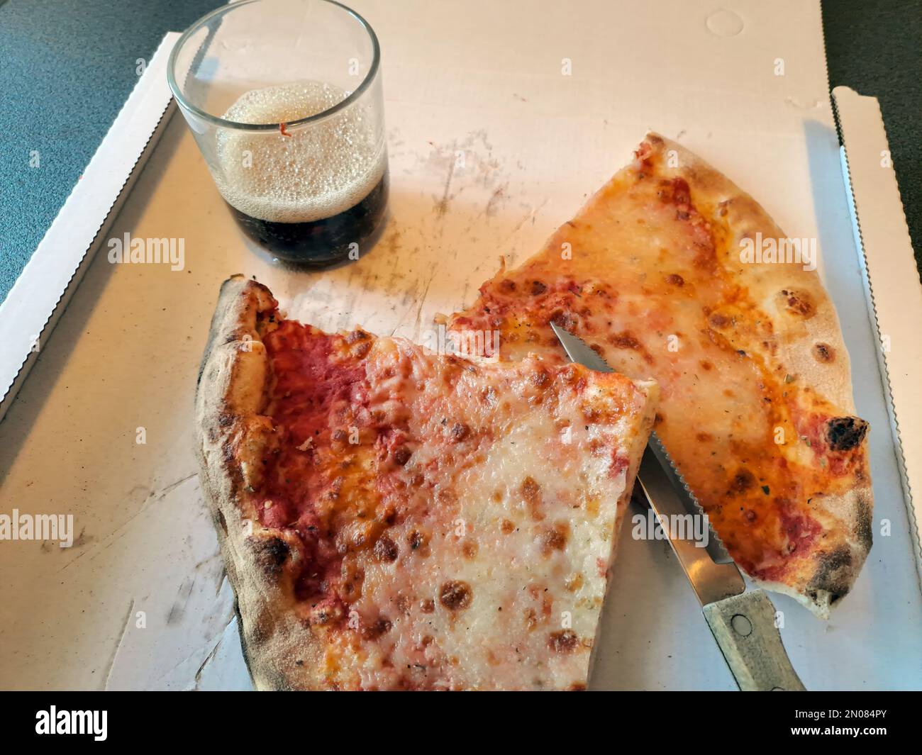 Slice of cheese pizza close-up real life Stock Photo