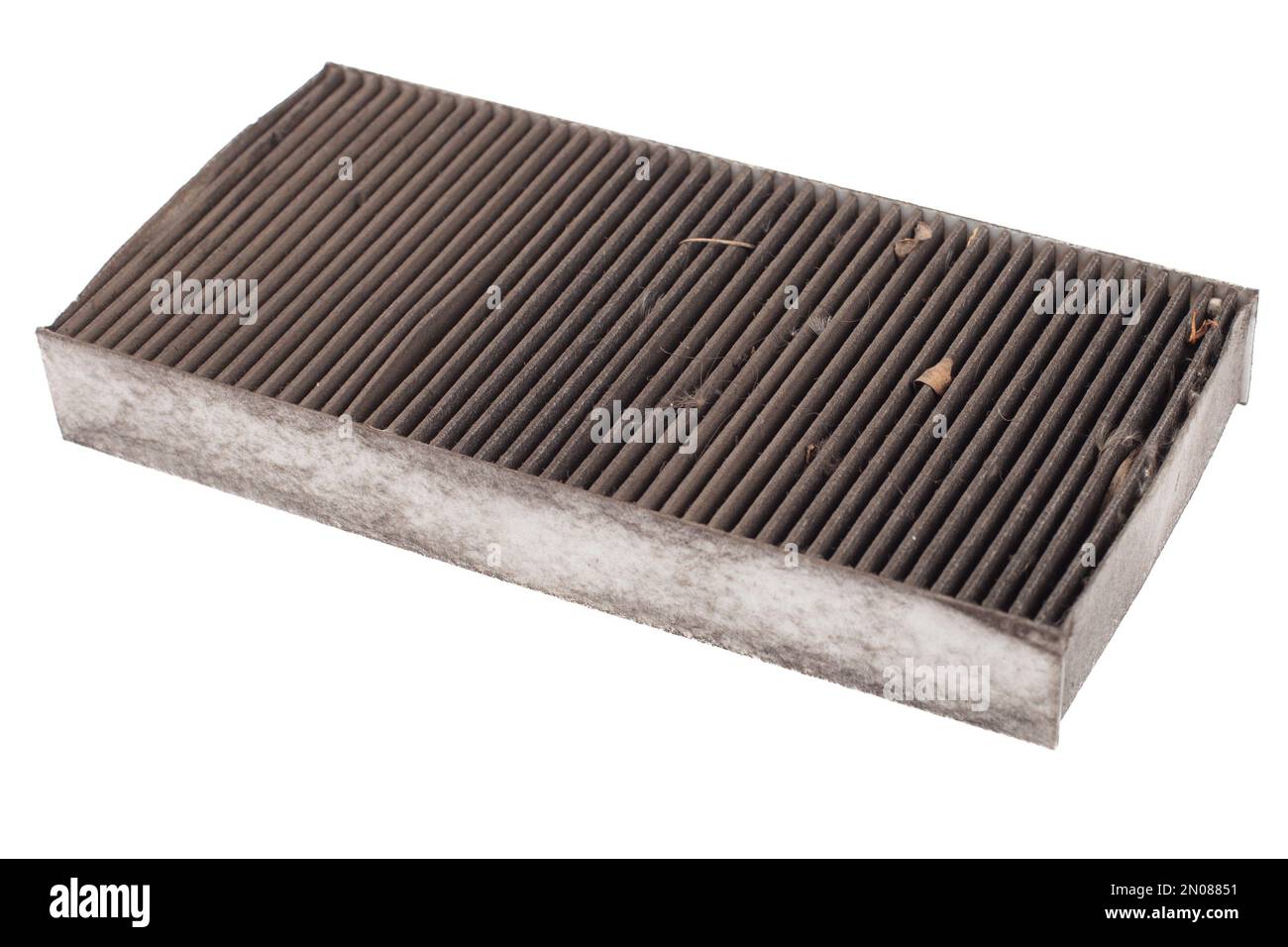 Dirty used cabin air conditioner filter isolated on white background