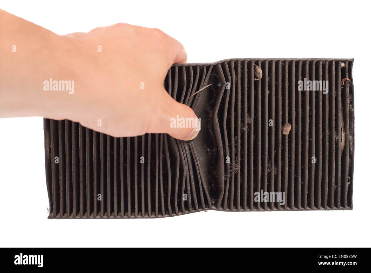 Showing in hands old car air filter close up. Dirt air conditioning