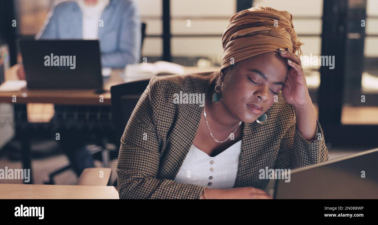 Business, stress and black woman in office, night and overworked. African American female, employee and administrator with depression, tired and Stock Photo