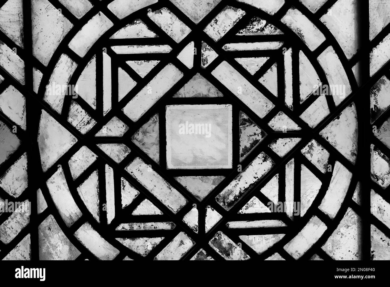 Geometric shapes of a beautiful medieval stained glass window in a