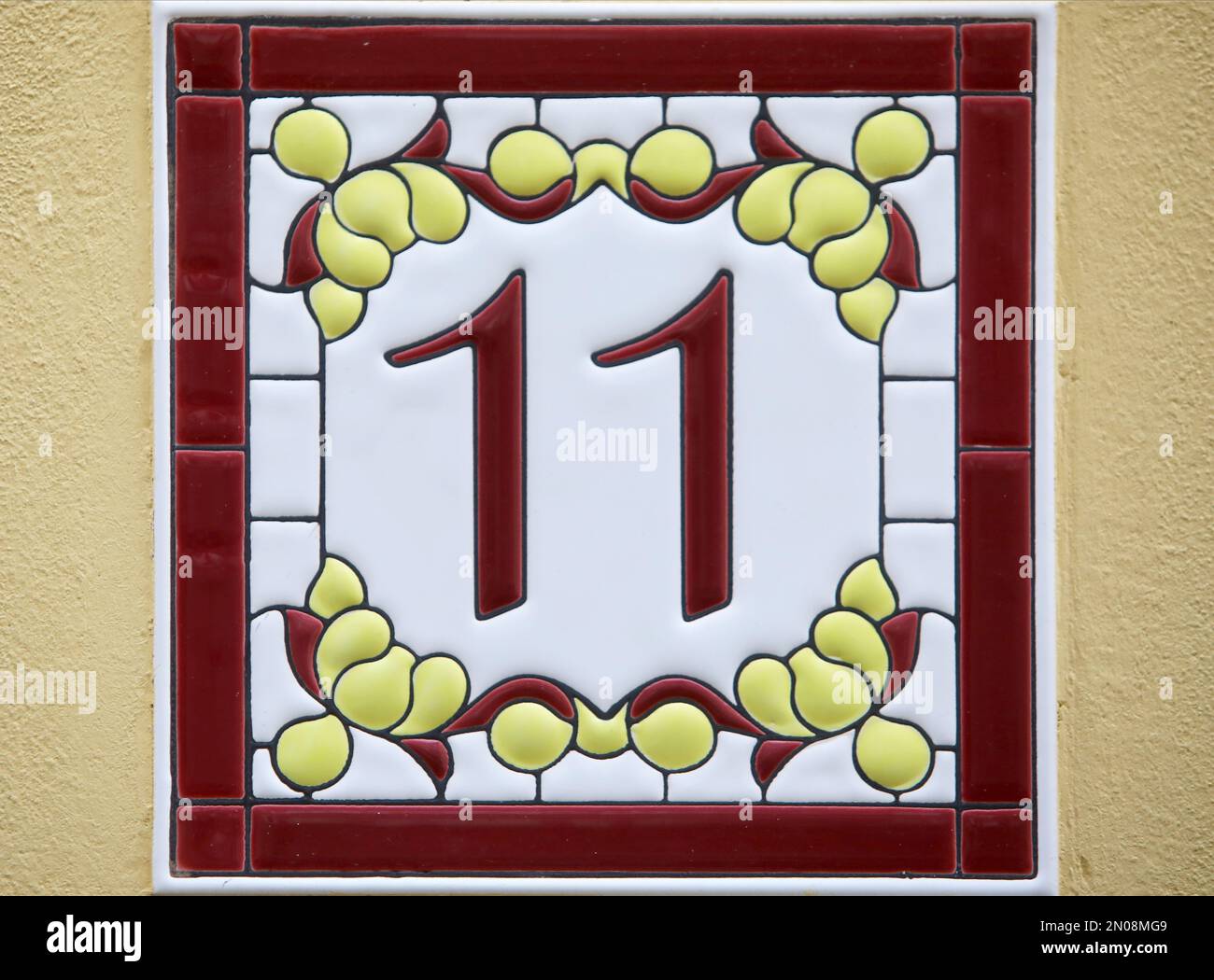 Vintage square ceramic street number plate with number. Close up, brand Stock Photo Alamy