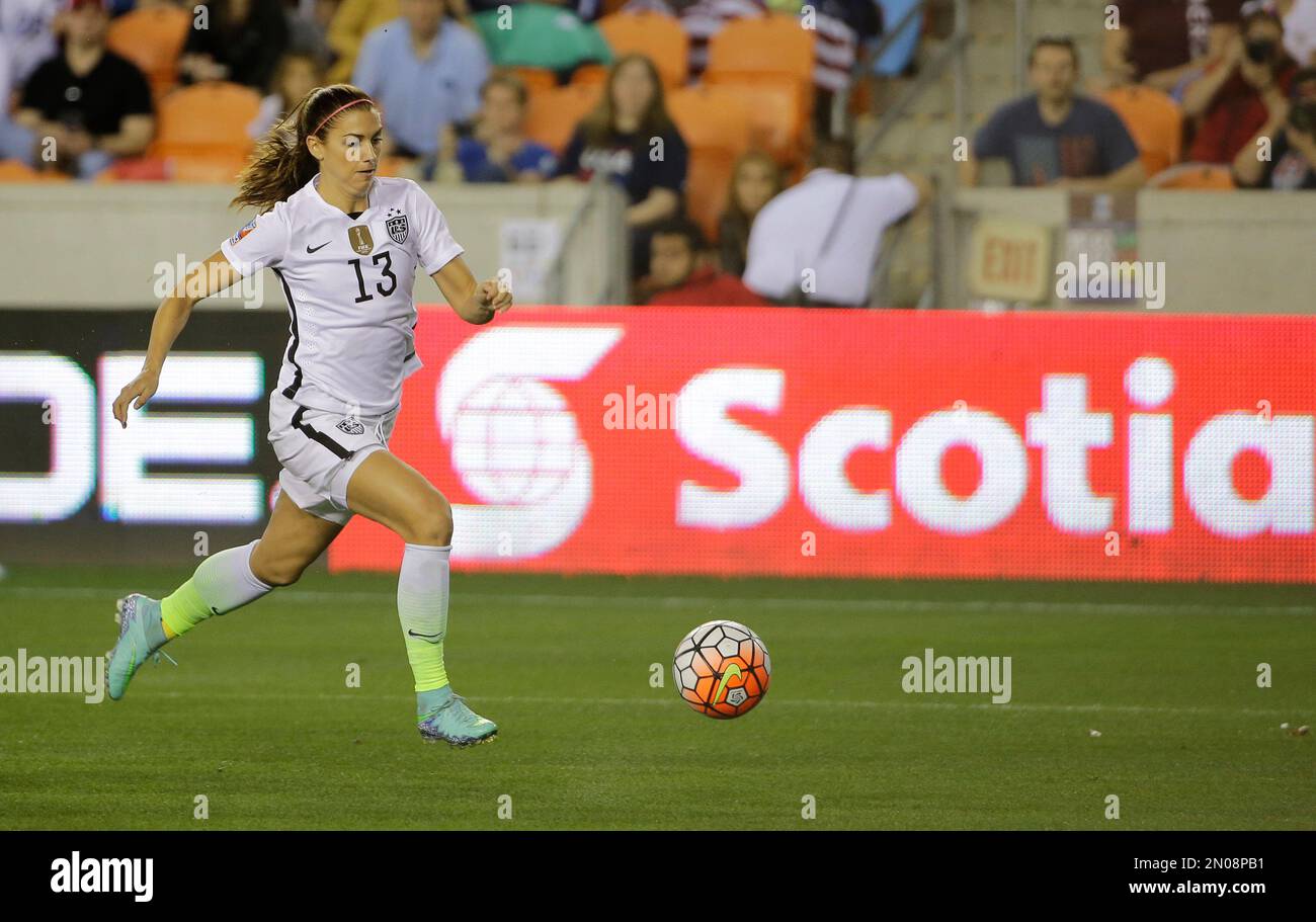 United States’ Alex (13) looks to shoot against Trinidad and
