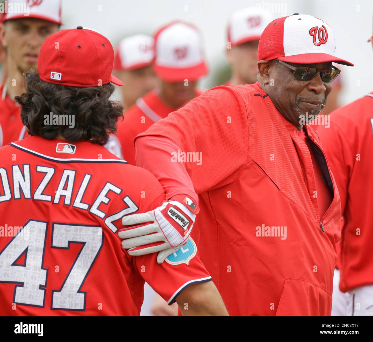 Washington Nationals manager Dusty Baker, greets starting pitcher Gio ...