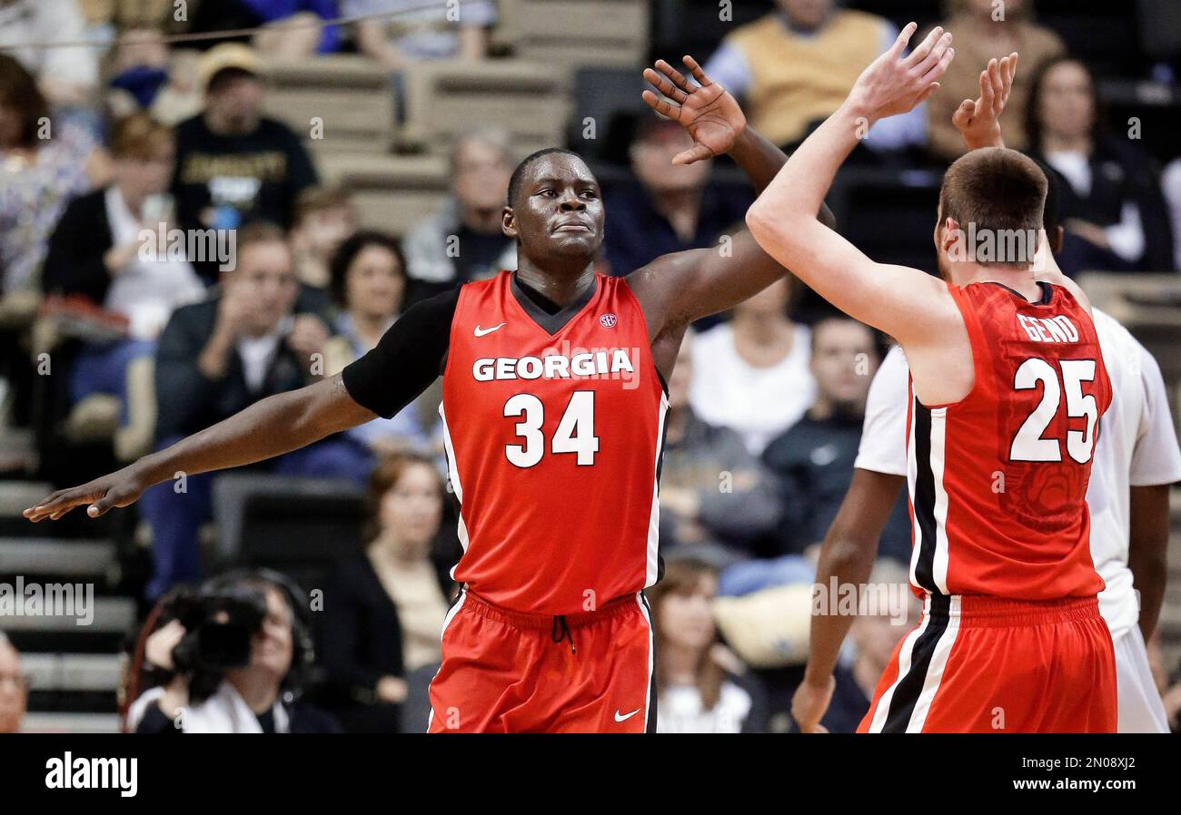 forward Derek Ogbeide (34) celebrates with Kenny Paul Geno (25