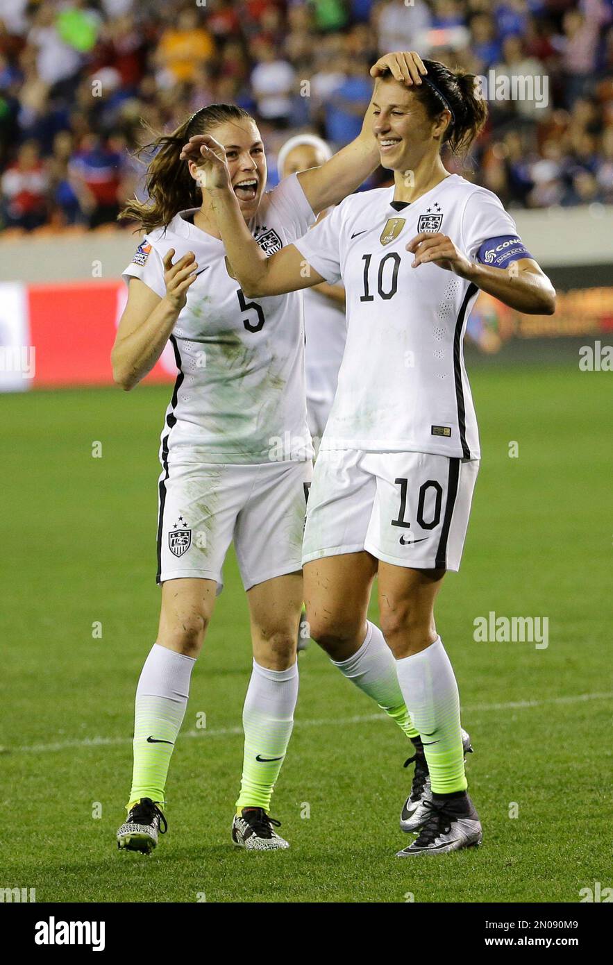 United States' Carli Lloyd (10) celebrates with Kelley O'Hara (5) after