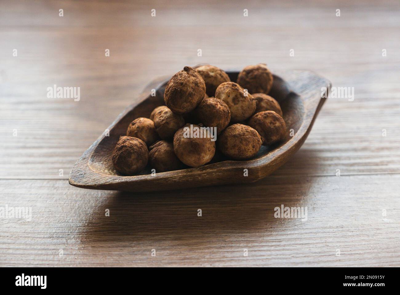 Bambara groundnut or Vigna subterranea which still covered with soil.Vigna subterranea ripens its pods underground, much like the peanut. They can be Stock Photo