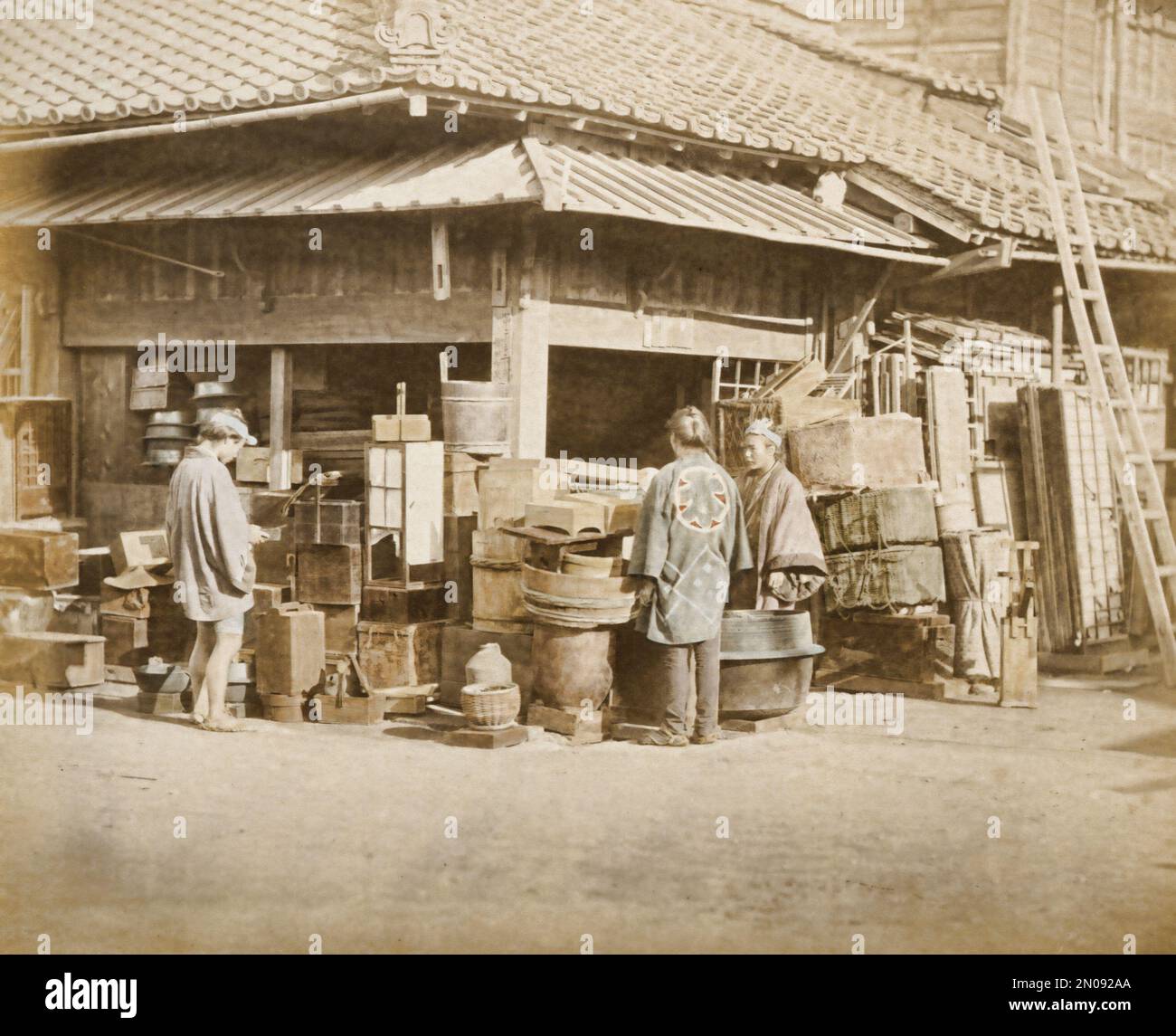 A photograph of a Japanese shop, published in Views & Costumes of Japan by Stillfried and Andersen (Yokohama, 1877). Stock Photo