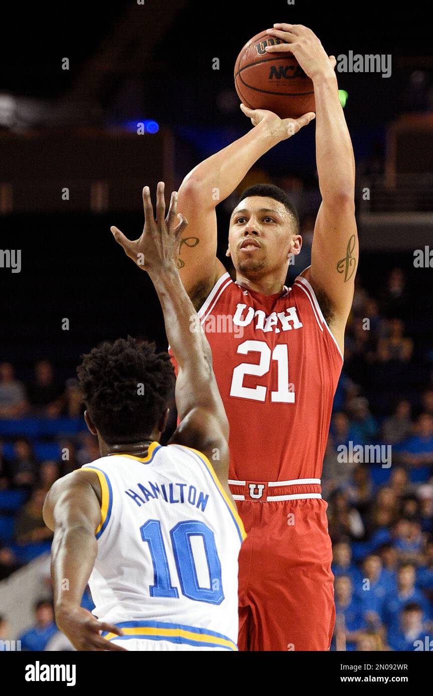 Utah forward Jordan Loveridge, top, attempts a shot in front of UCLA