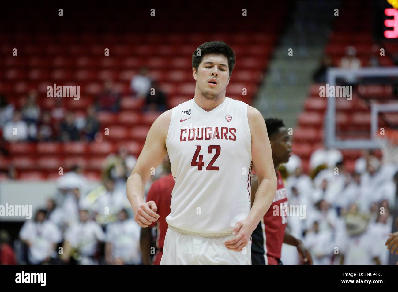 Washington State's Conor Clifford (42) jogs on the court during the