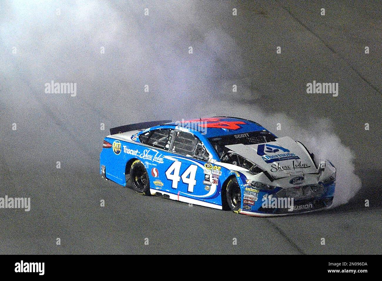 Smoke pours out of the Brian Scott (44) car after hitting the wall ...