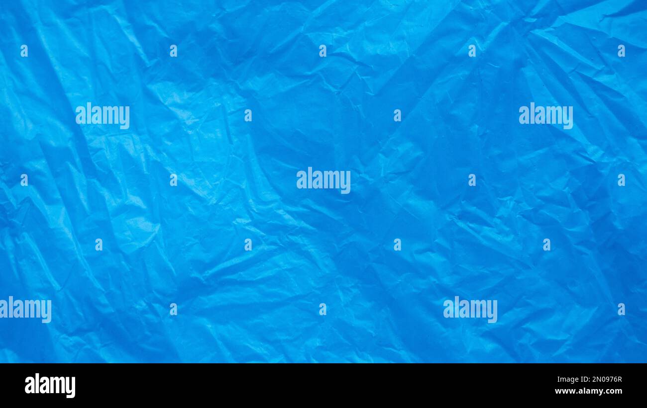 Blue and crumpled plastic bag background and texture. Stock Photo