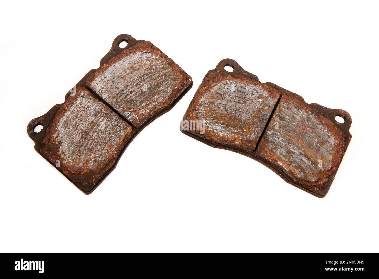 The old used and rusty disc brake pads isolated in a white background