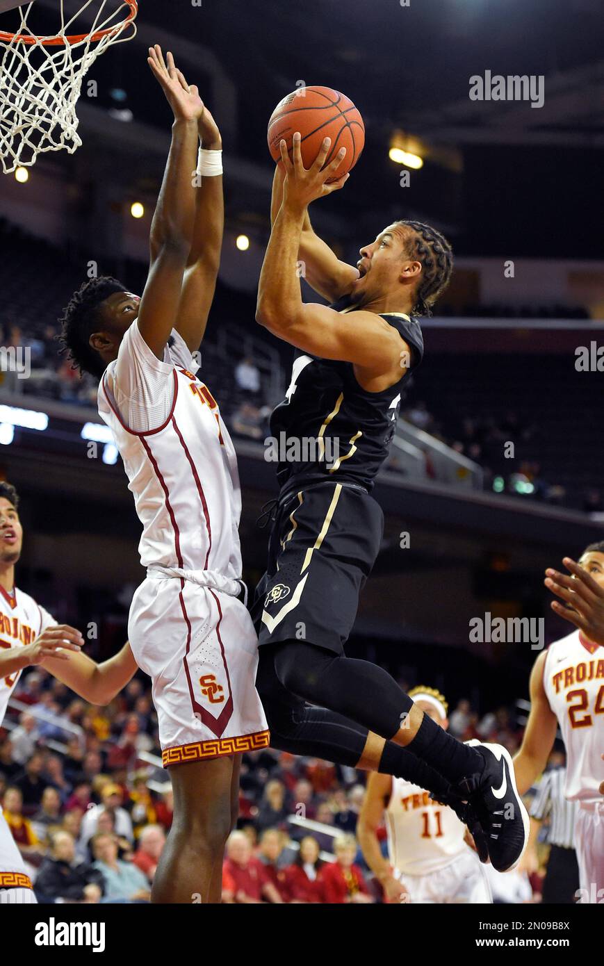 Colorado guard Josh Fortune, right, shoots as Southern California ...