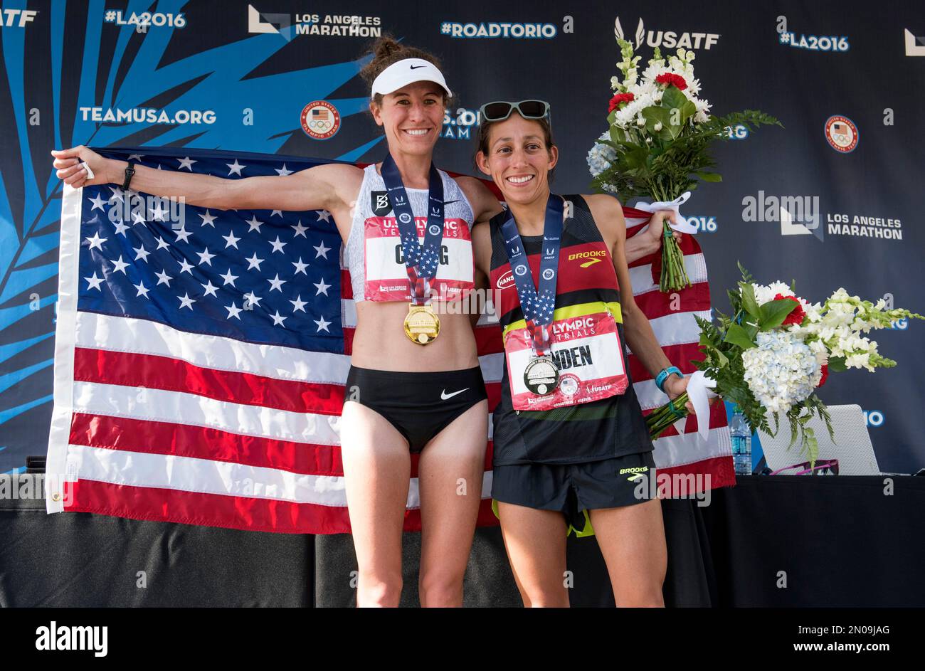 Amy Cragg, left, and Desiree Linden, right, pose for a photo after