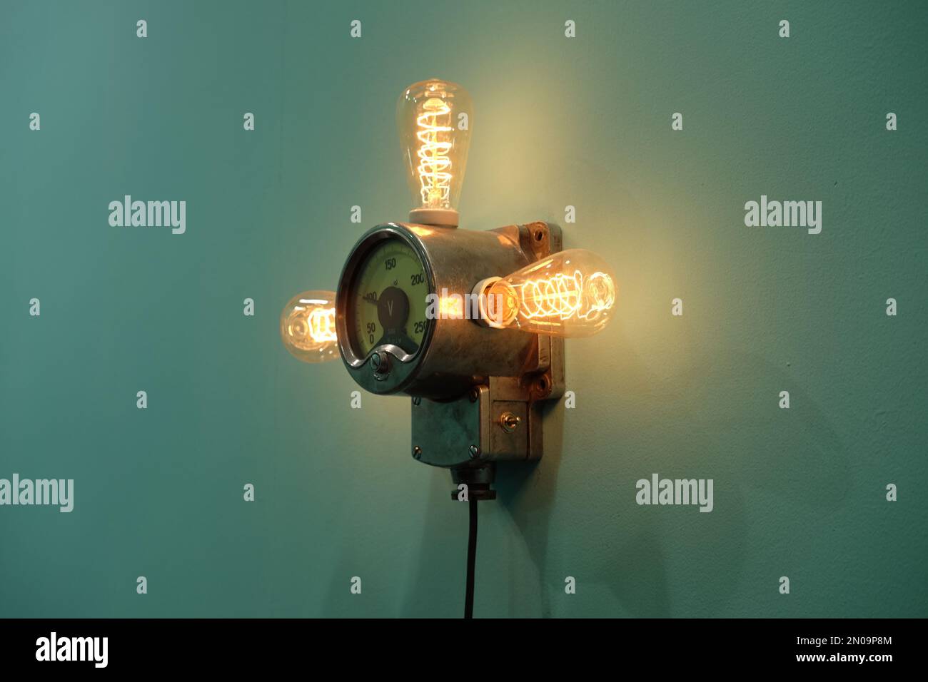 Vintage tungsten decorative lamp on clean wall Stock Photo