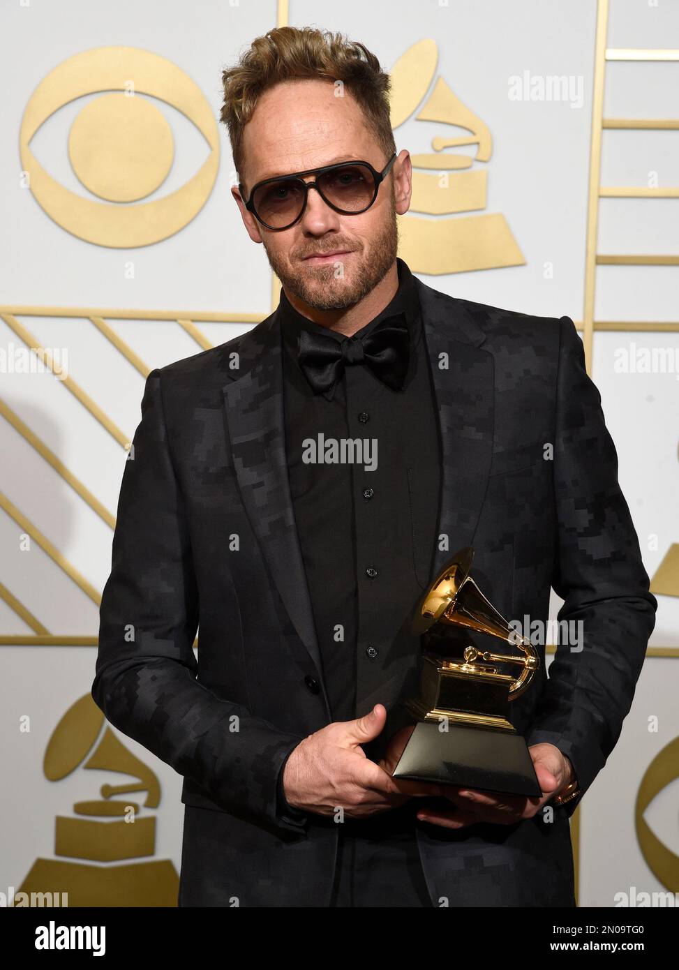 TobyMac poses in the press room with the award for best contemporary ...