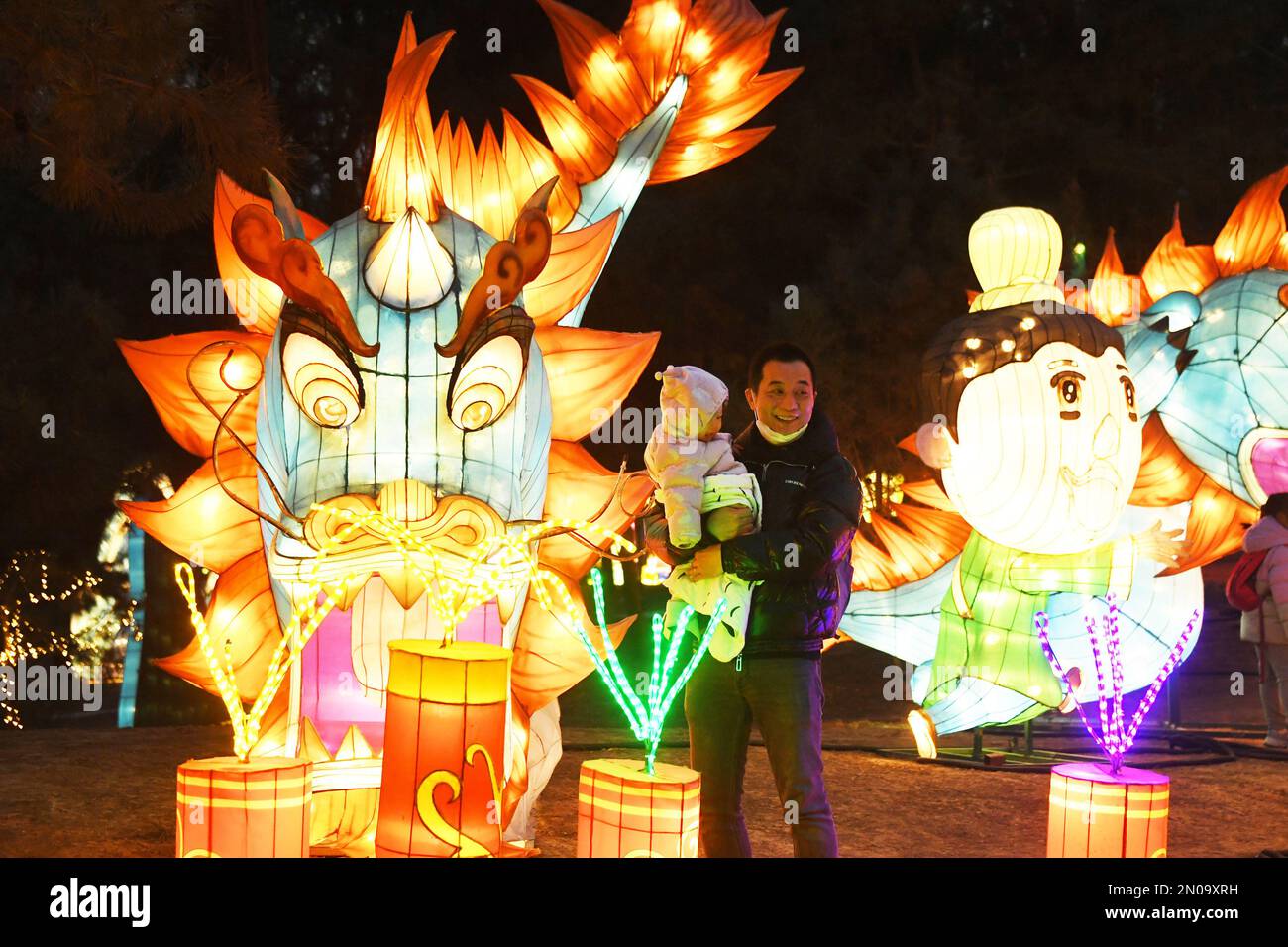 Beijing, China. 5th Feb, 2023. Tourists visit a light show at Nangong