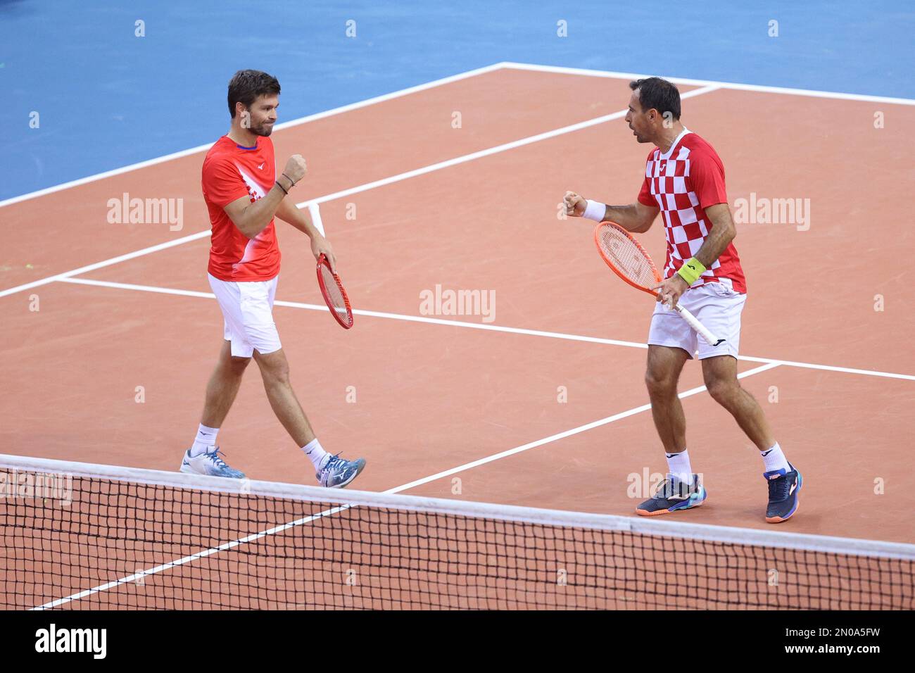 RIJEKA, CROATIA - FEBRUARY 05: Ivan Dodig of Croatia and Nikola Mektic of  Croatia celebrate a point against Alexander Erler of Austria and Lucas  Miedler of Austria during the Davis Cup qualifiers