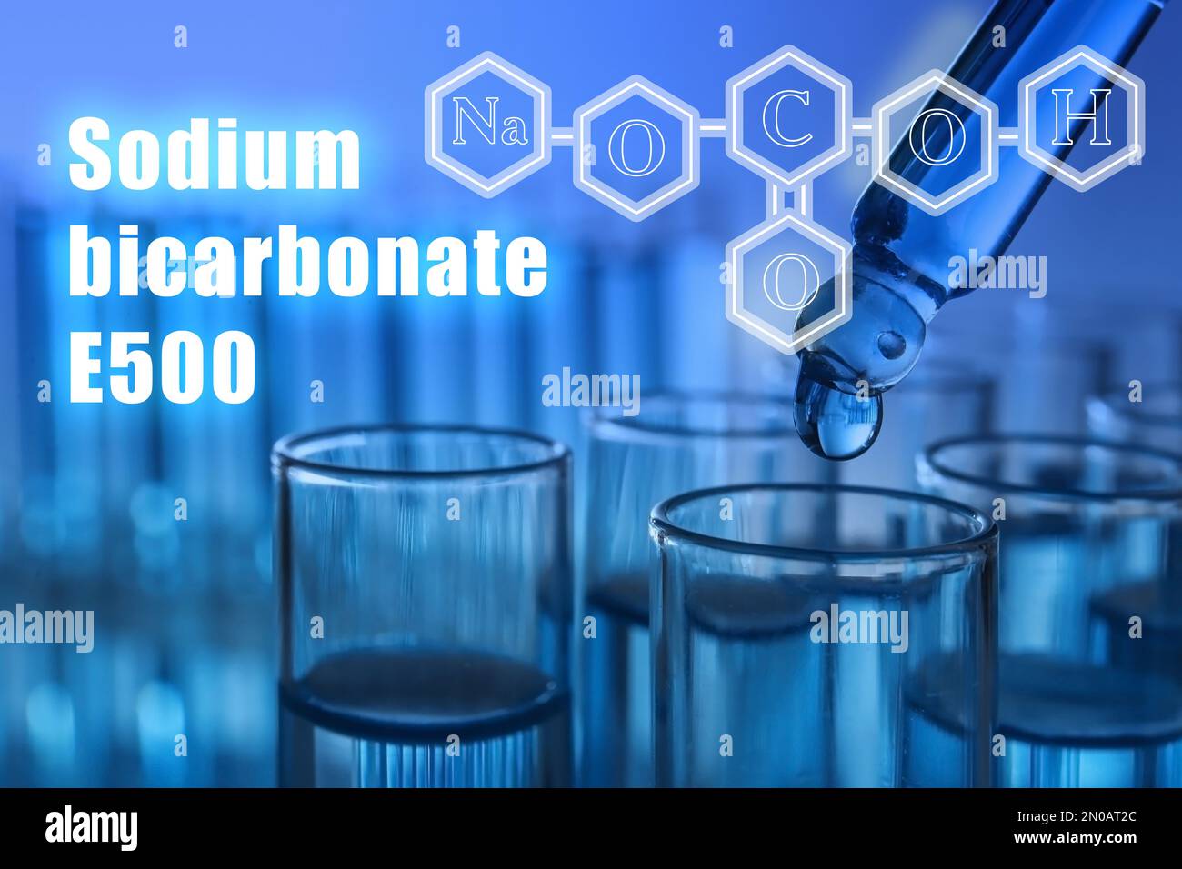 Text Sodium bicarbonate E500 with soda formula and test tubes on