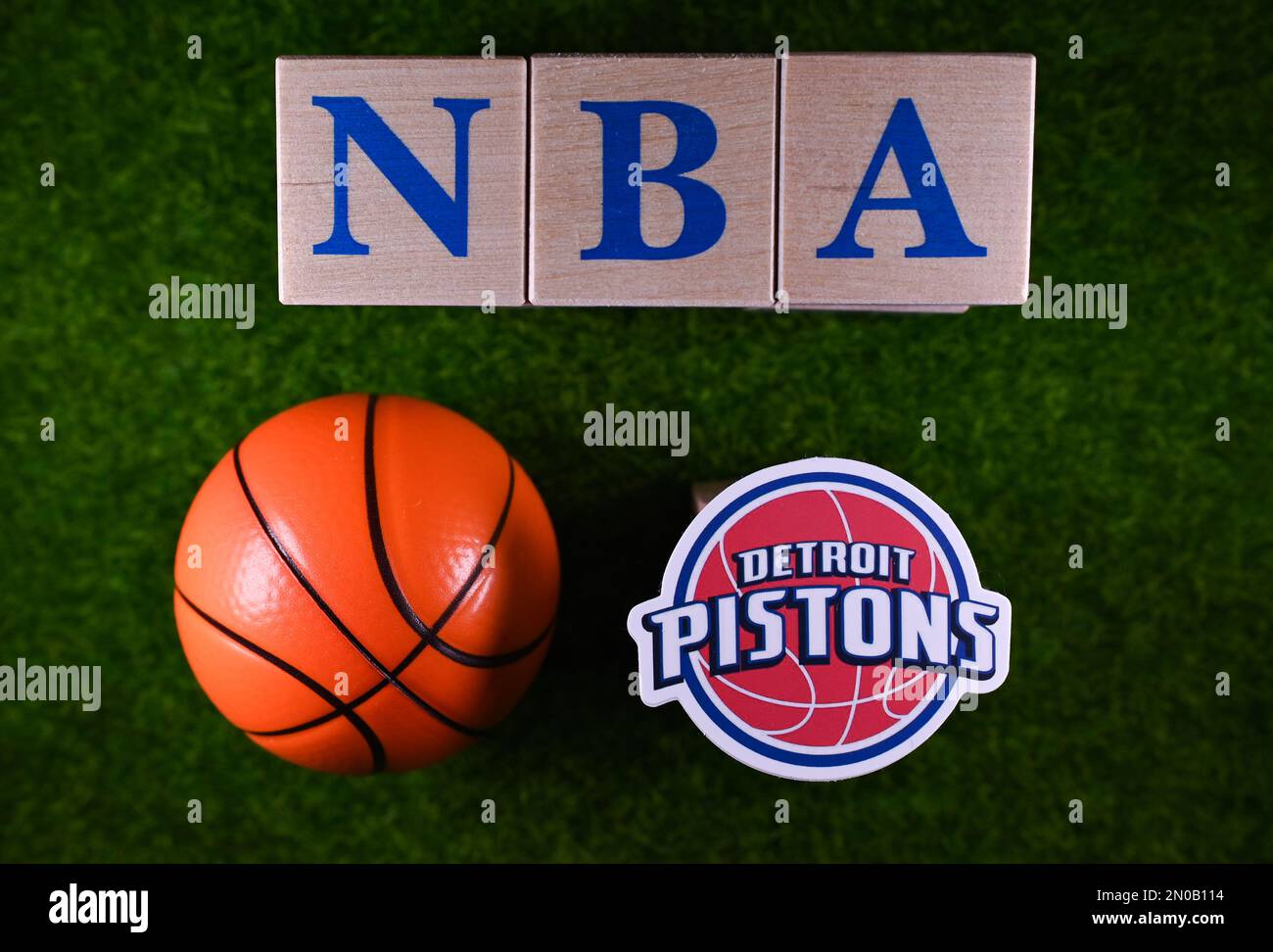 January 30, 2023, Springfield, USA. The emblem of the Detroit Pistons National Basketball Association club on the green lawn of the stadium. Stock Photo