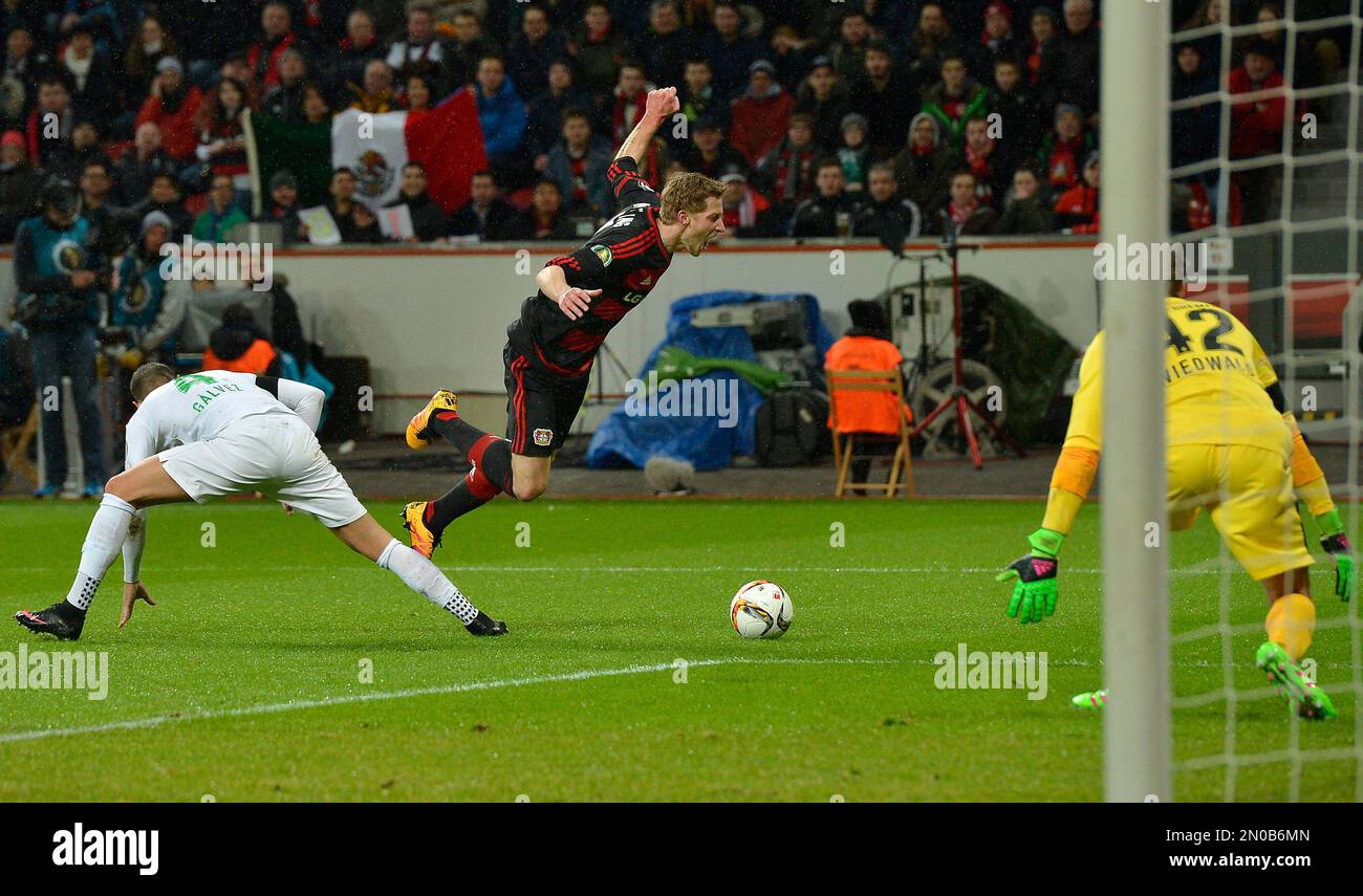 Bremen's Alejandro Galvez, left, fouls Leverkusen's Stefan Kiessling in