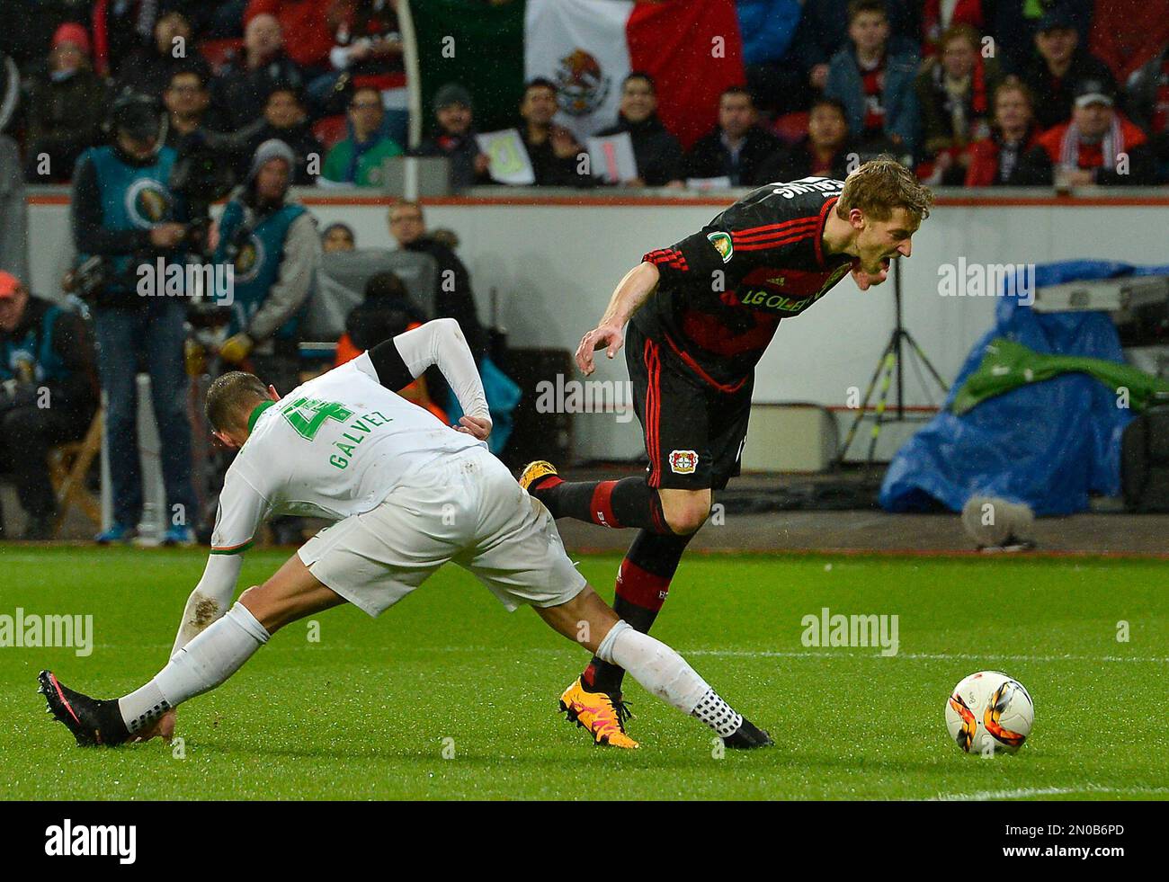 Bremen's Alejandro Galvez, left, fouls Leverkusen's Stefan Kiessling in