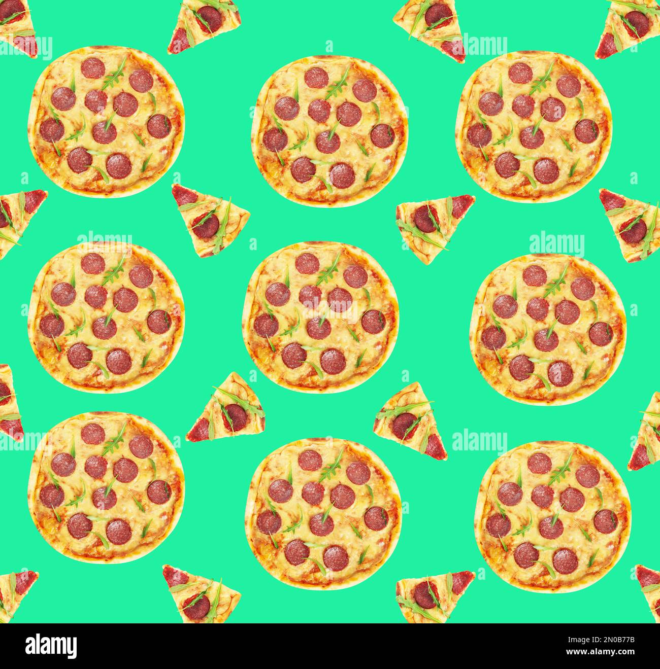 Pepperoni pizza pattern design on light green background Stock Photo