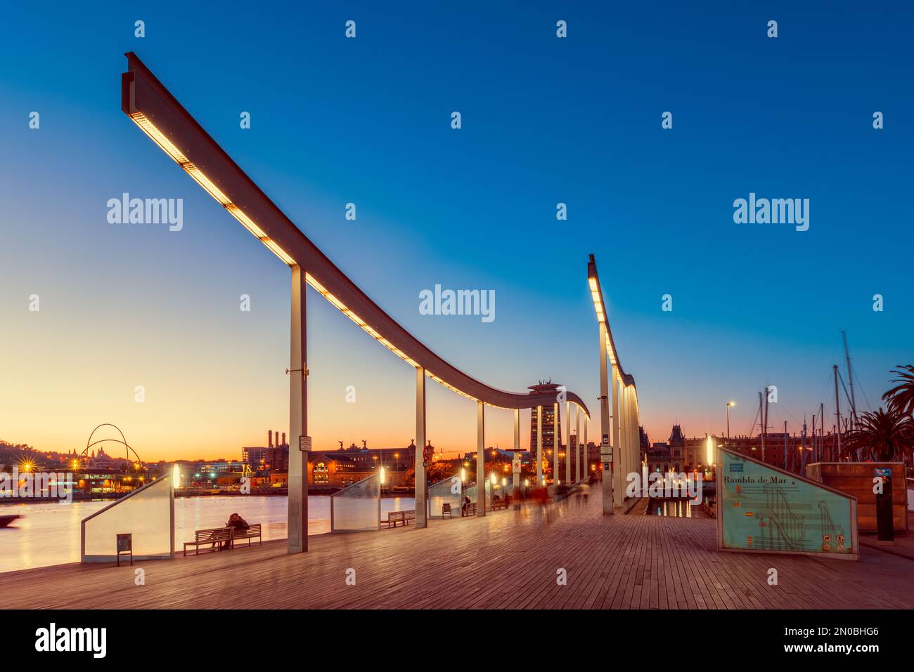 Rambla de Mar is a wooden walkway in the harbor of Barcelona Spain, aimed to symbolize the connection with the Mediterranean. Stock Photo