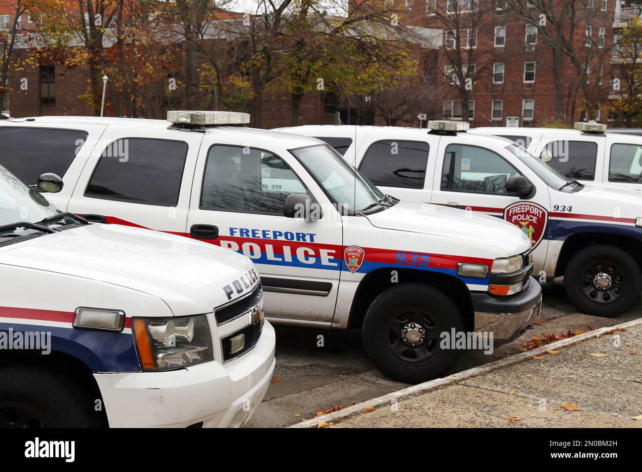 In this Nov. 19, 2015, photo, police department vehicles are lined up