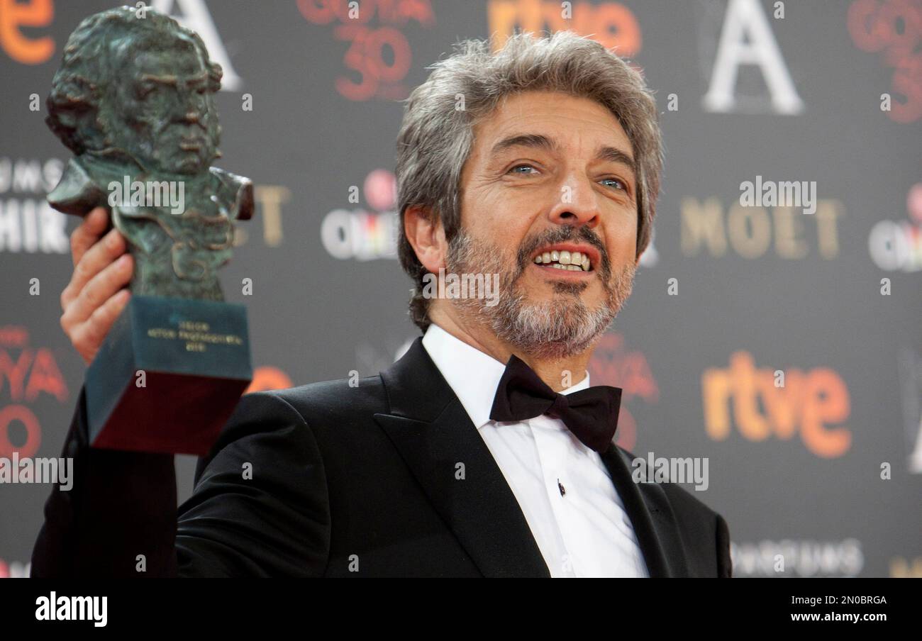 Argentine actor Ricardo Darin holds the Goya prize after winning the ...