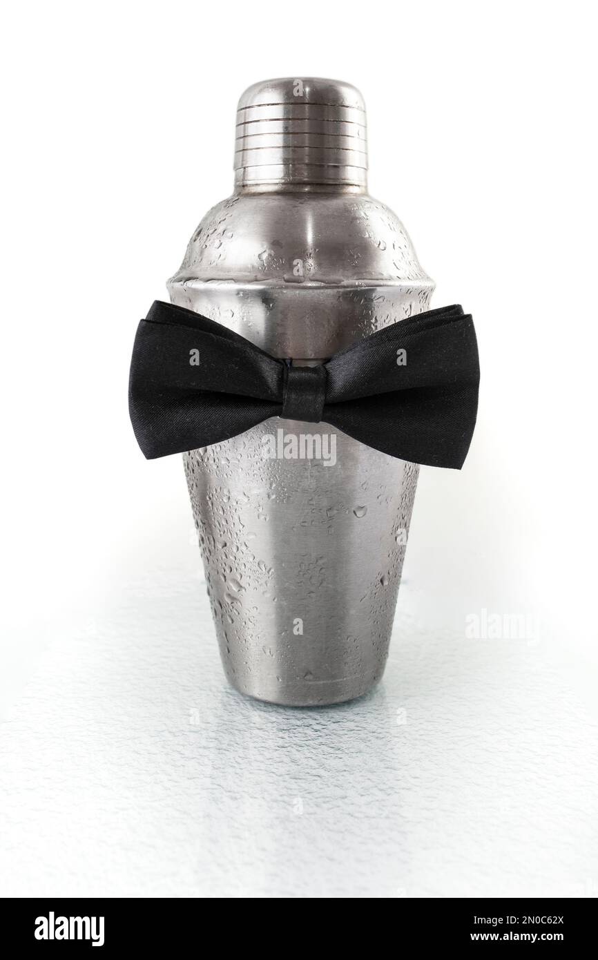 Bartender cocktail shaker with a black bowtie isolated on white background  , soft focus close up Stock Photo