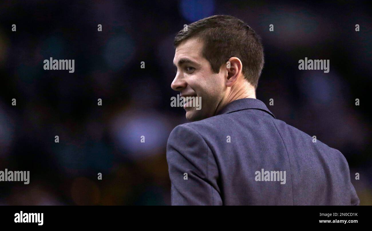 Boston Celtics head coach Brad Stevens smiles as he heads back to the