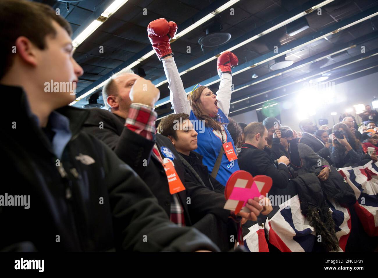 Hillary Boxing A member of the audience wears boxing gloves as she cheers before ...