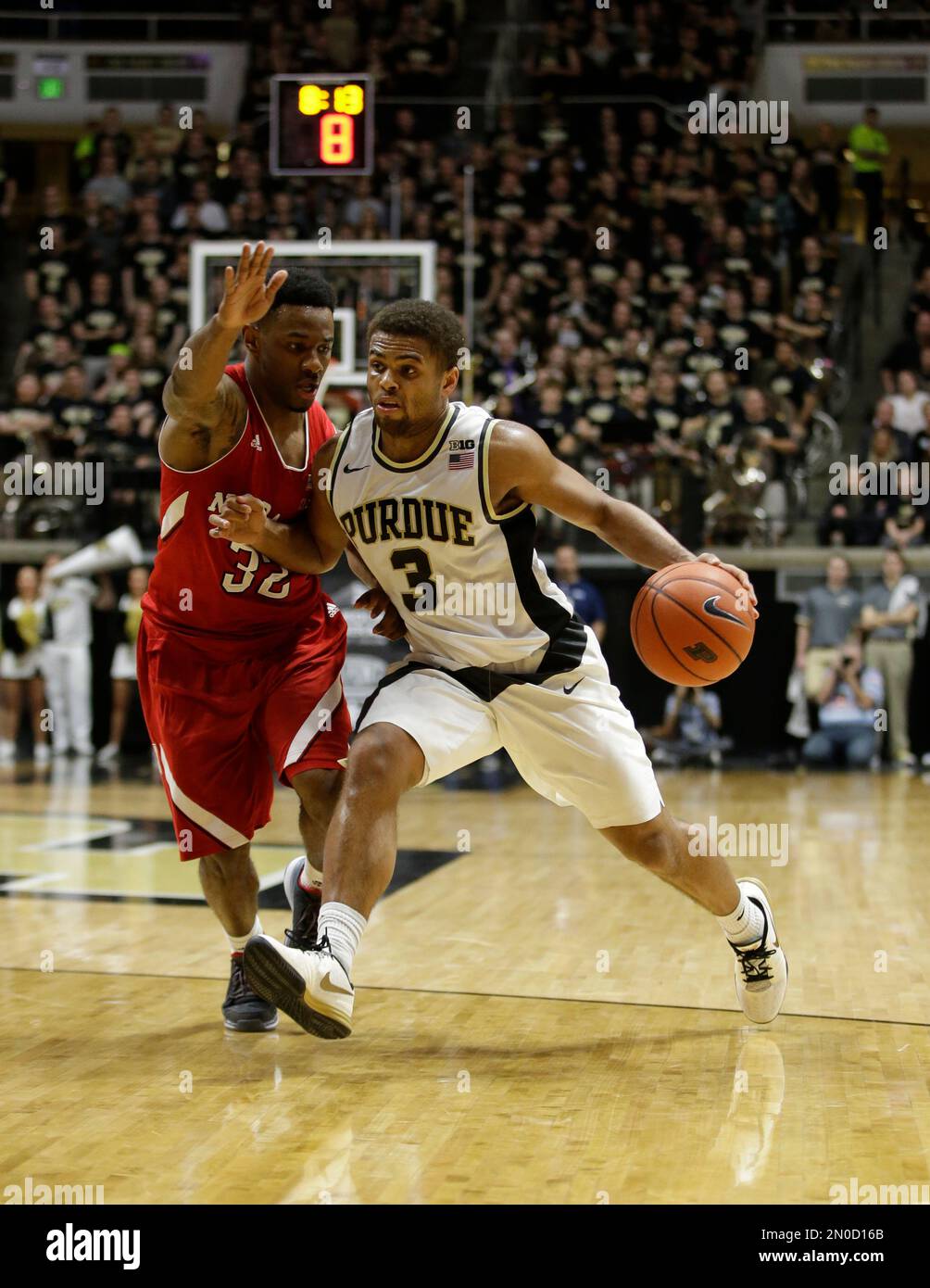 Purdue's P.J. Thompson (3) is defended by Nebraska's Benny Parker (32