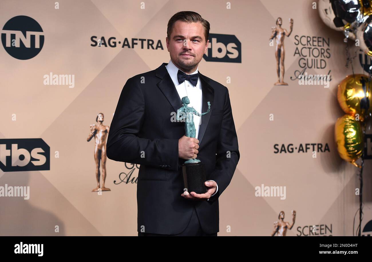 Leonardo DiCaprio poses in the press room with the award for
