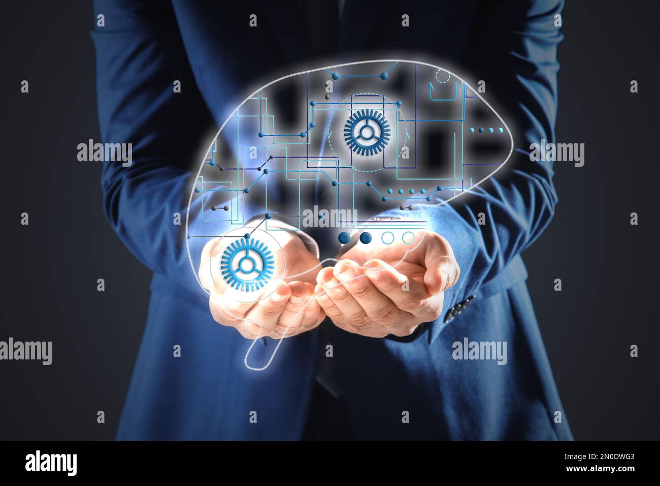 Businessman demonstrating digital image of brain on dark background, closeup. Machine learning concept Stock Photo