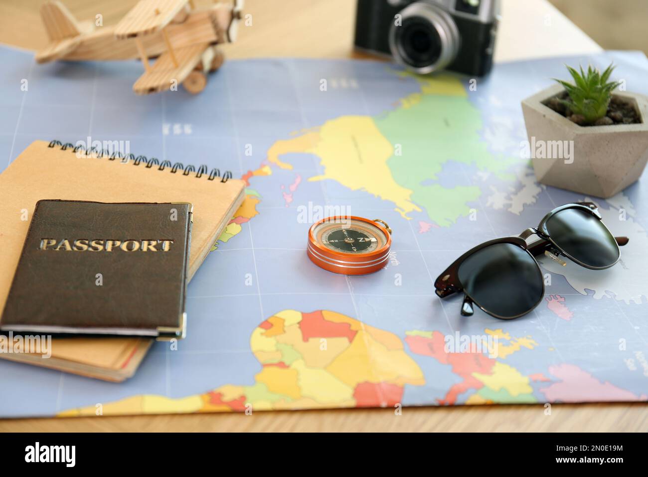 Composition with world map and different items on table. Trip planning Stock Photo