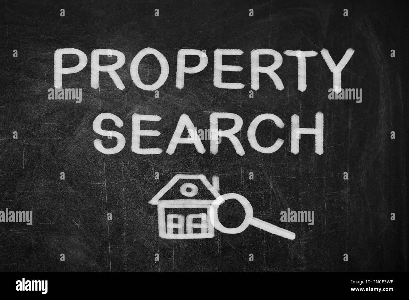Text Property Search with house and magnifier illustration on black