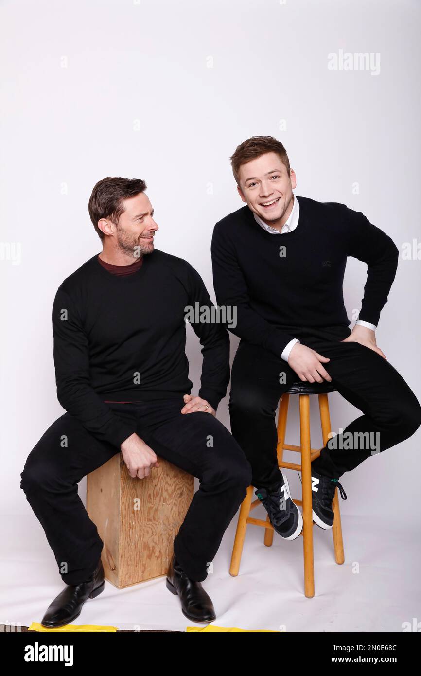 Actors Hugh Jackman, left, and Taron Egerton pose for a portrait to