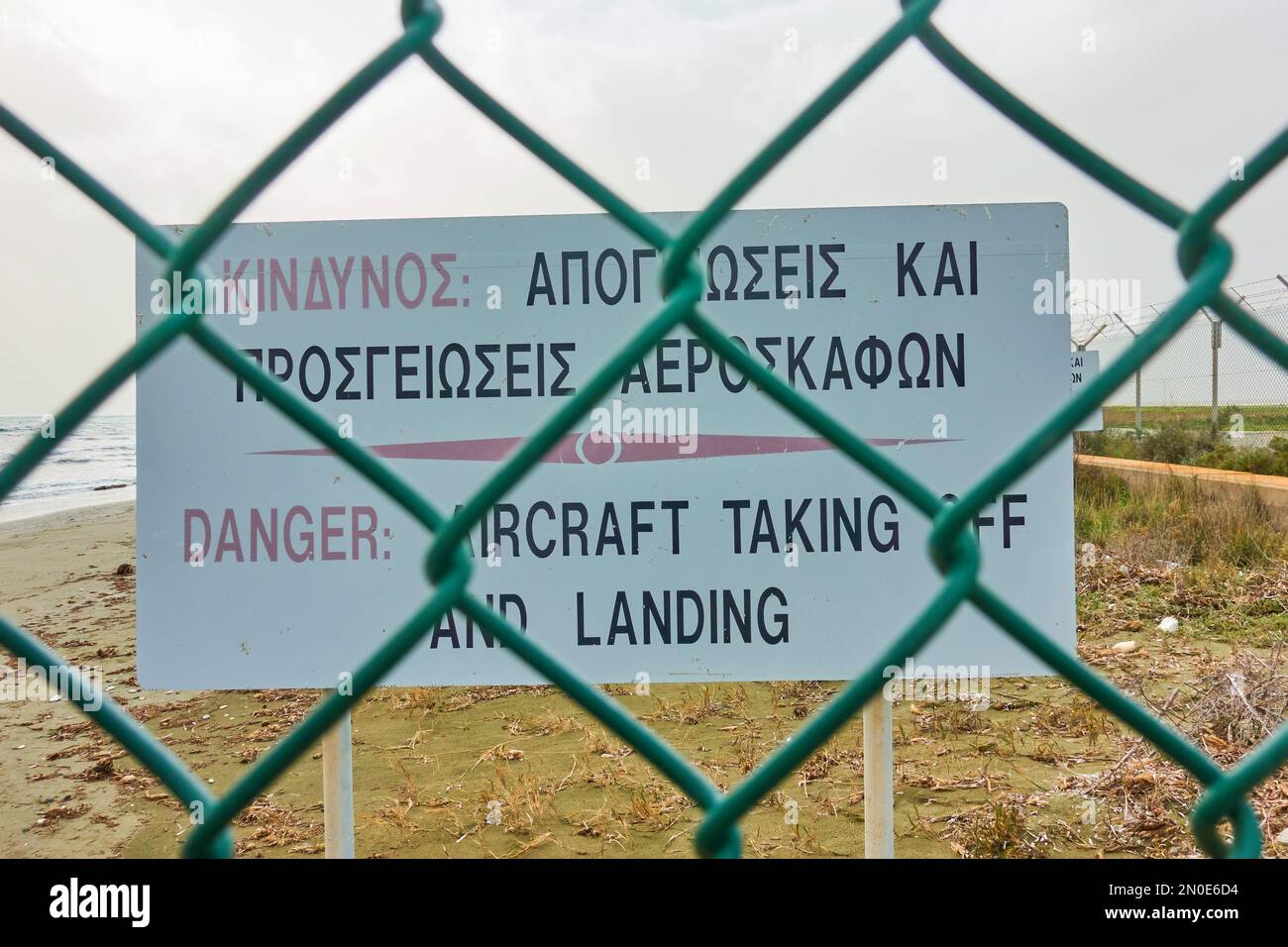 Larnaca, Cyprus - January 27, 2019: Warning sign at Mackenzie beach - famous plane spotting site Stock Photo