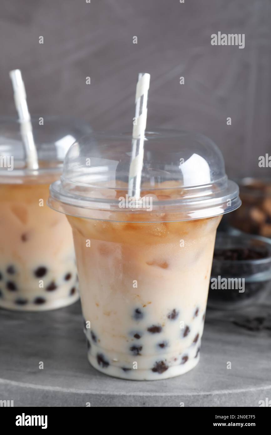 Tasty milk bubble tea on grey board, closeup Stock Photo - Alamy