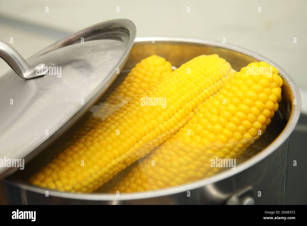 Yellow corn cobs boiling hi-res stock photography and images - Alamy