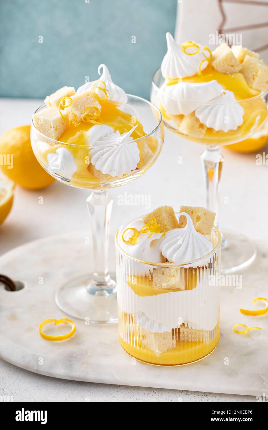 Lemon parfait with pound cake, lemon curd, whipped cream and meringue kisses Stock Photo Alamy