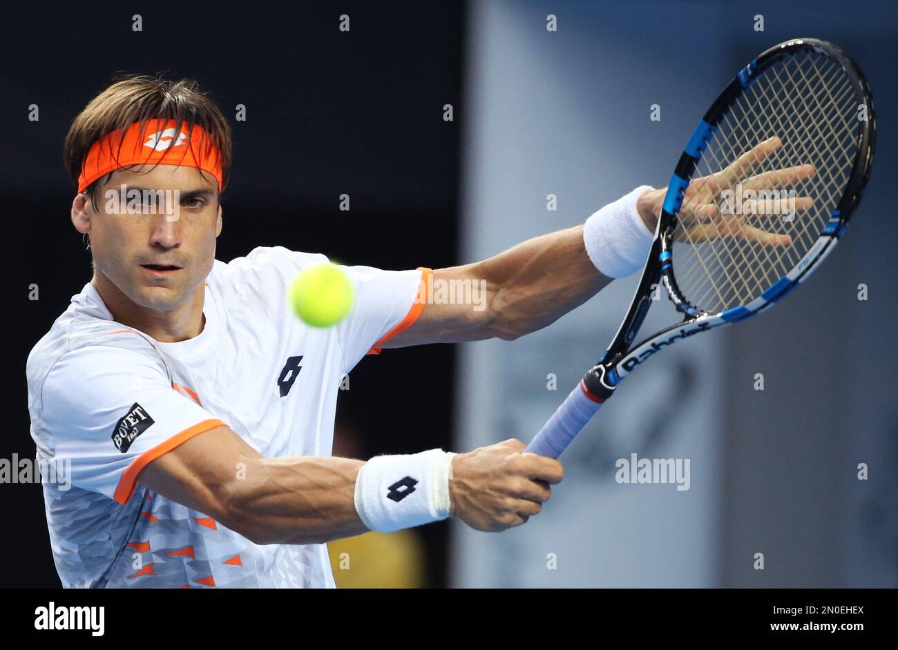 David Ferrer of Spain hits a backhand return to John Isner of the United  Statesduring their fourth round match at the Australian Open tennis  championships in Melbourne, Australia, Monday, Jan. 25, 2016.(AP