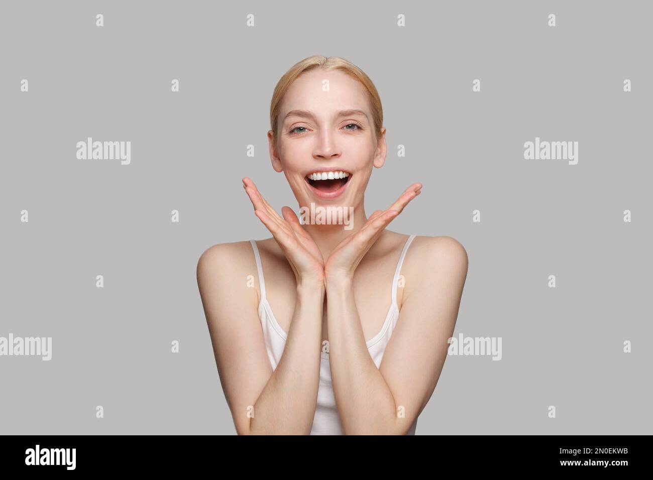 Cute happy surprised young woman, beauty portrait Stock Photo - Alamy