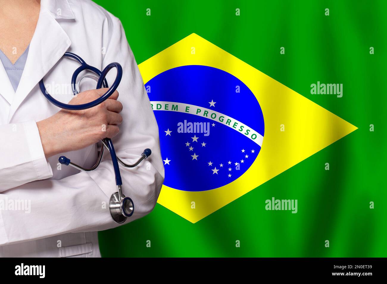 Brazilian medicine and healthcare concept. Doctor close up against flag