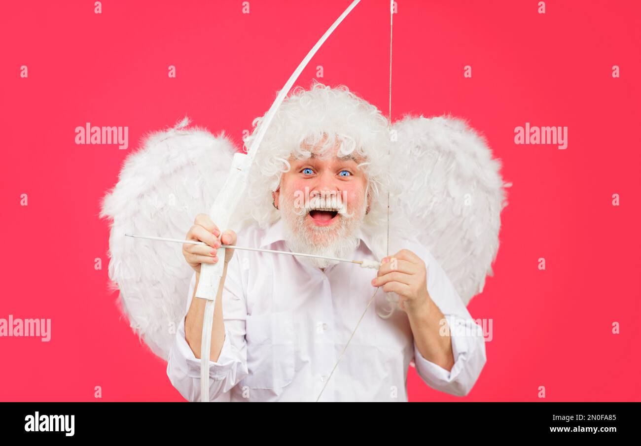 Valentines day celebration. Valentine cupid in angel wings with bow and arrows. Love concept. Stock Photo