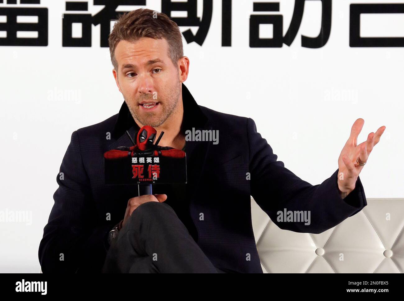 Canadian actor Ryan Reynolds answers questions during a news conference