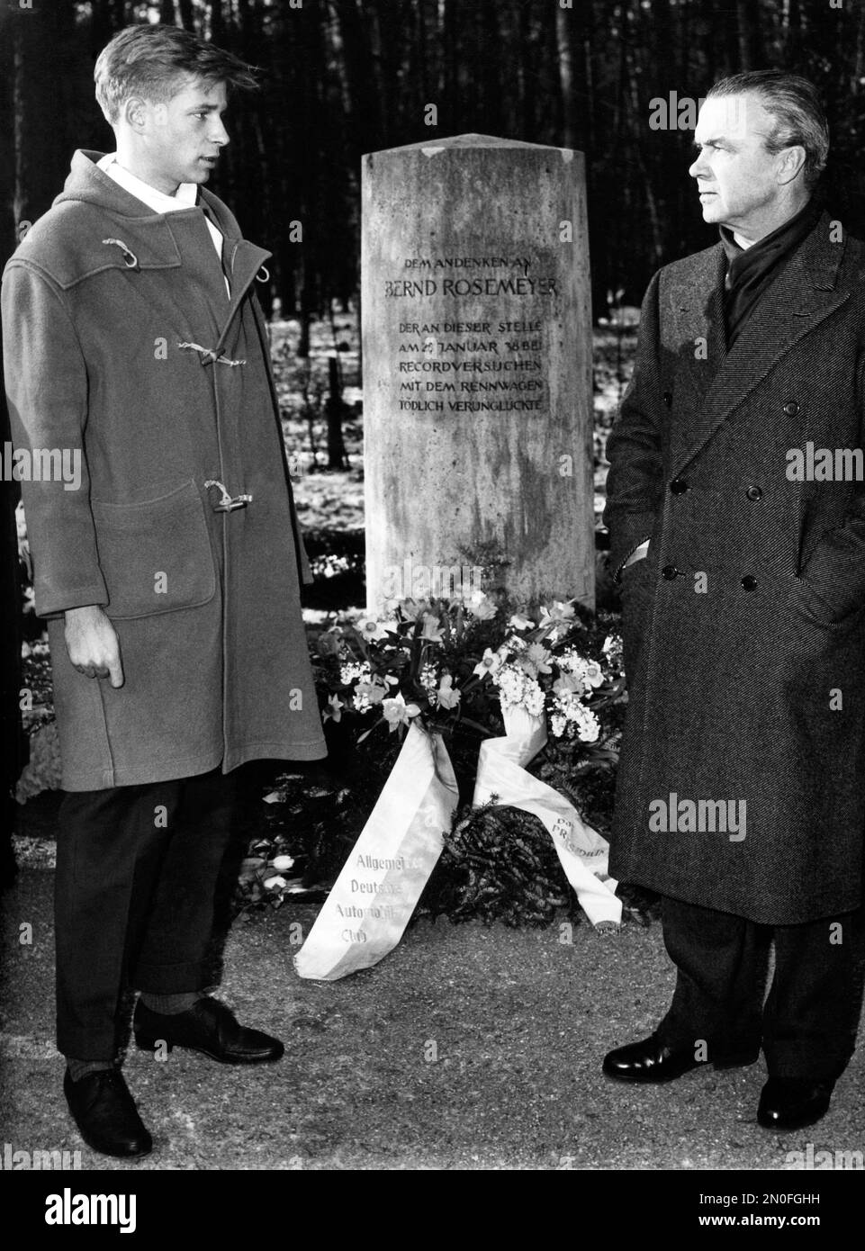 Bernd Rosemeyer Jr. and Rudolf Caracciola in front of the grave of ...